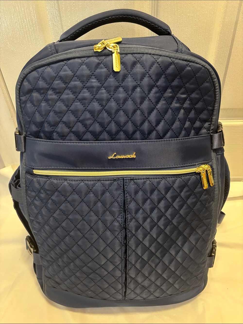 Navy Blue Quilted Backpack with Gold Hardware